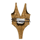 Traje de baño de una pieza metálico con lazo y estampado de piel de serpiente cruzado en la parte delantera.