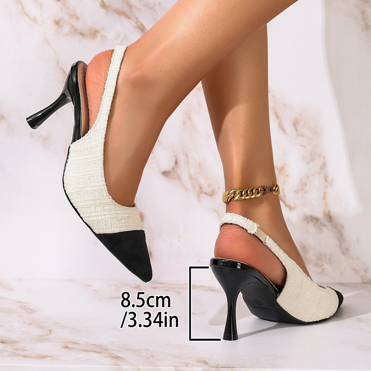 Elegante spitze Damenschuhe mit hohem Absatz und Strasssteinen