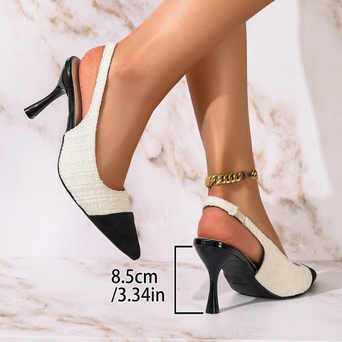 Elegante spitze Damenschuhe mit hohem Absatz und Strasssteinen