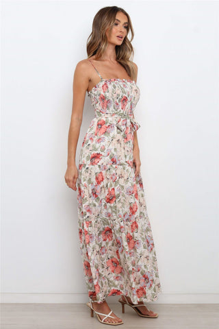 Vestido midi con volantes, tirantes y estampado floral