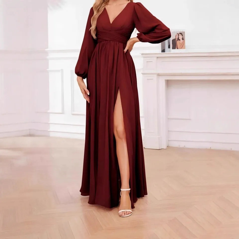 Vestido largo con cinturón, mangas abullonadas y botones
